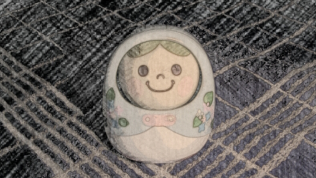 Eine lächelnde kleine Figur auf kariertem Untergrund